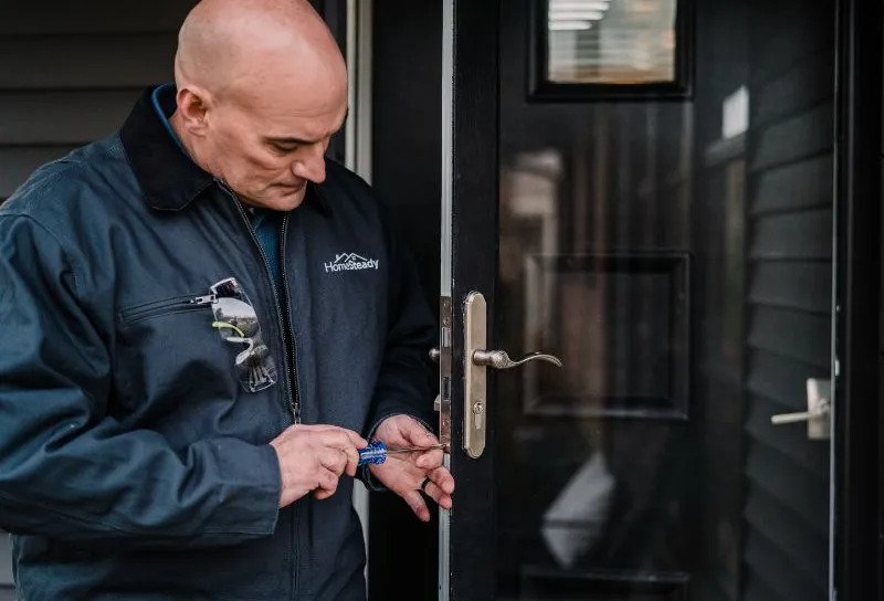 handyman installs door handle