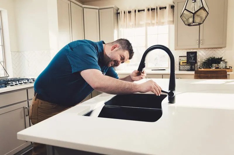 Handyman Repairing Sink